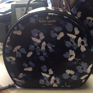 Small and medium Kate Spade travel cases